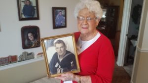 Betty Long holds Navy photo of her husband Elmer.