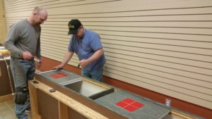 Oath Keepers Dave Morris and Nick Getzinger paint new store.