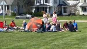 Community picnic held in green space in response to armed walk.