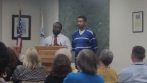 Damien Womack and Antrone Moore talk to city council about stroke awareness.