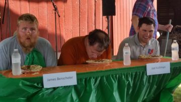 James Benschoter, Chris Henschen and Joel Kuhlman dig into apple pies.