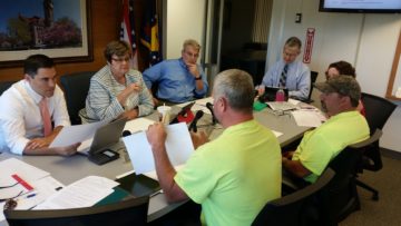 County commissioners listen to landfill staff.