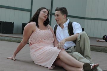 Hermia (Nicole Tuttle) convinces Lysander (Jishua Powell) that he should not sleep next to her.