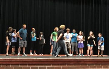In rehearsal last week, the animals cheer as Ms. Sloe the Tortoise (Sophi Hachtel) approaches the finish line.