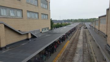 Crowd lined up along Amtrak tracks to see Hillary Clinton.