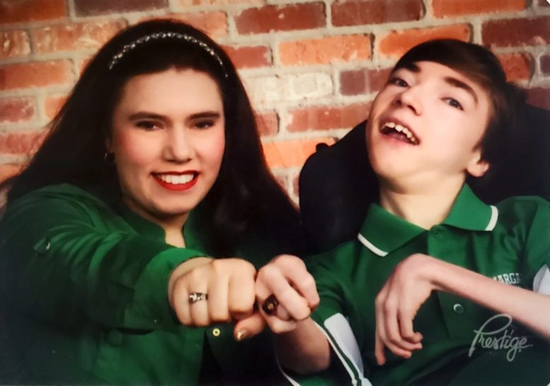 woman and man wear green shirts to promote cerebral palsy awareness