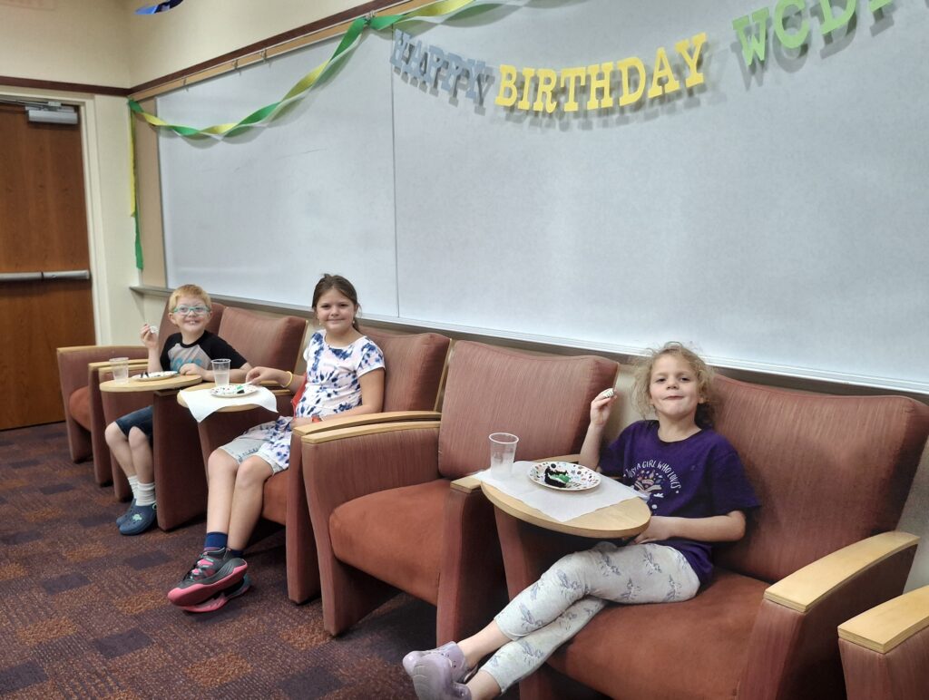 Max, Cammy and Lily Coakley eating birthday cake.