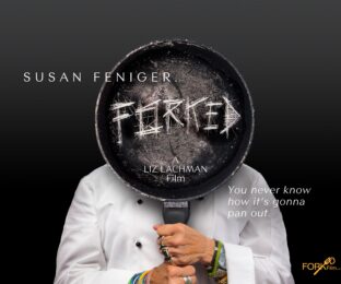 person in chef's uniform uses two hands to hold a cast iron skillet in front of their face. the skillet has the word "forked" etched into it.