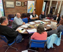 Laurie Manning, of Hylant insurance (far side of table on upper right) discusses property insurance with the WCDPL trustees.