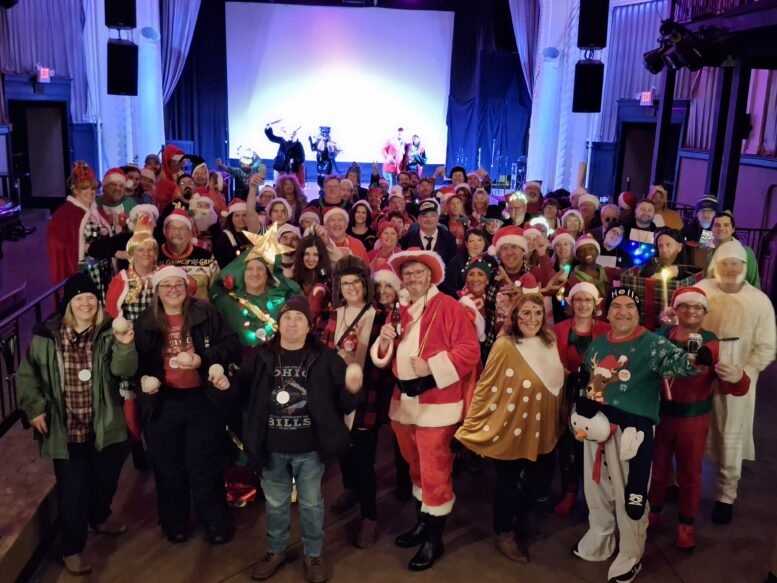 Group photo of event-goers in holiday costumes