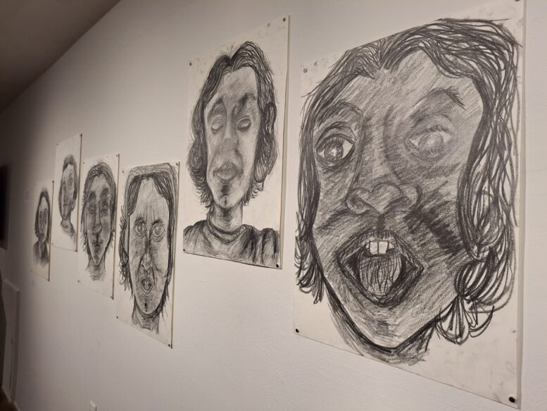 Large graphite drawings of faces