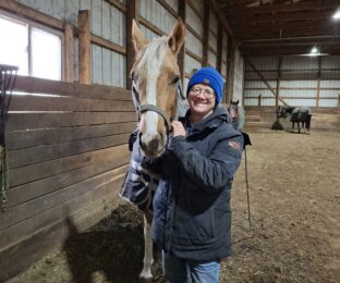 Stacey Creps with a horse.