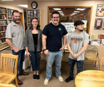 Science Cafe presenter Dr. James Metcalf and graduate students Ashlyn Malloy, Grant Hayden and Zachary Morris.